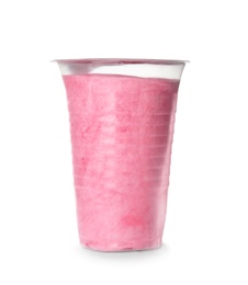 Photo of Yummy cotton candy in plastic cup on white background