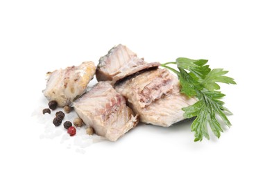 Photo of Delicious canned mackerel chunks with parsley and spices on white background
