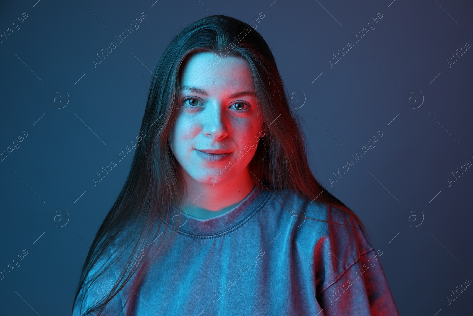 Photo of Portrait of beautiful young woman on color background