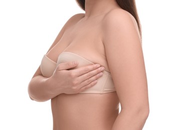 Photo of Mammology. Woman in bra doing breast self-examination on white background, closeup