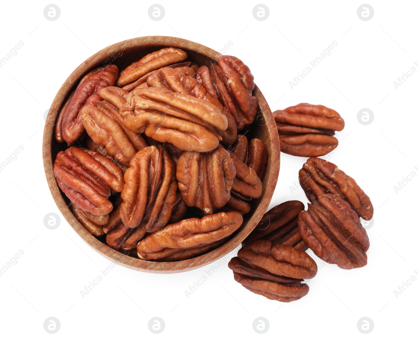 Photo of Tasty pecan nuts in bowl isolated on white, top view