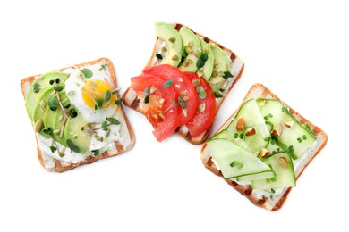 Delicious sandwiches with microgreens on white background, top view