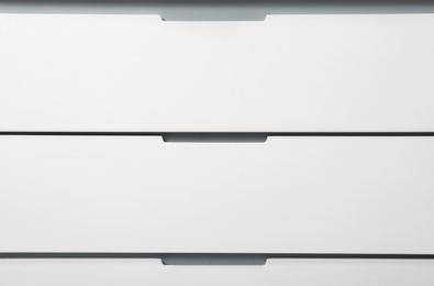 Modern white chest of drawers as background