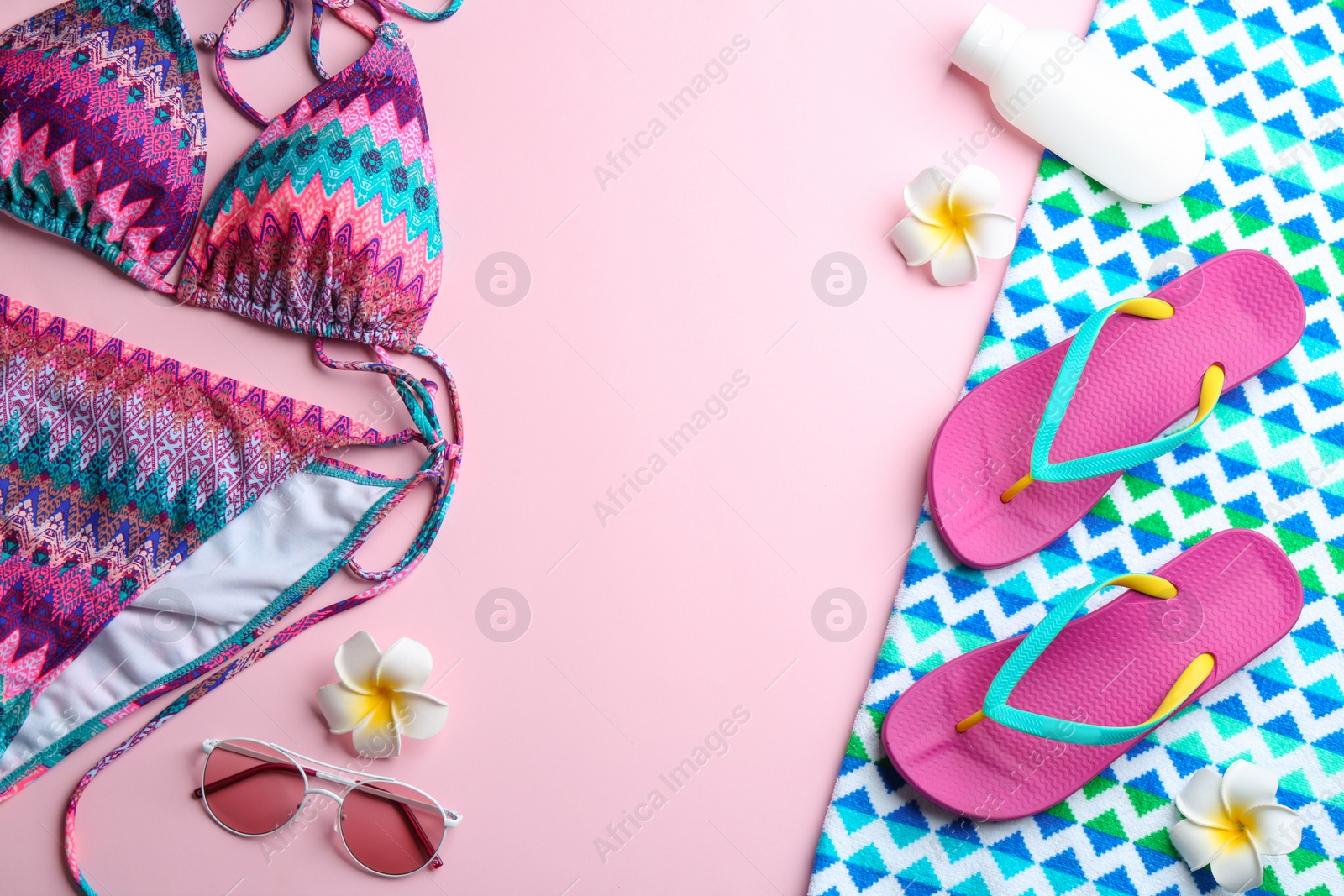 Photo of Flat lay composition with beach accessories on color background. Space for text