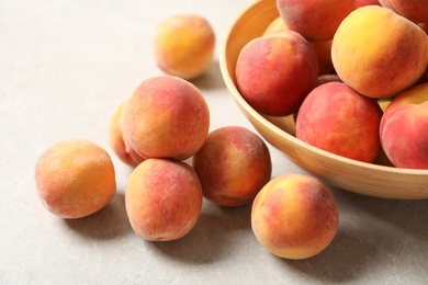 Photo of Many delicious ripe peaches on table, closeup