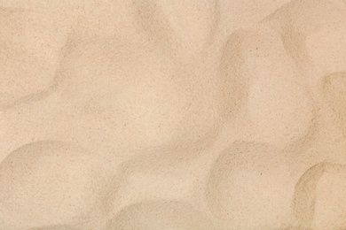 Photo of Dry beach sand as background, top view