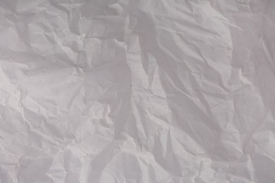 Photo of Texture of crumpled parchment paper as background, top view