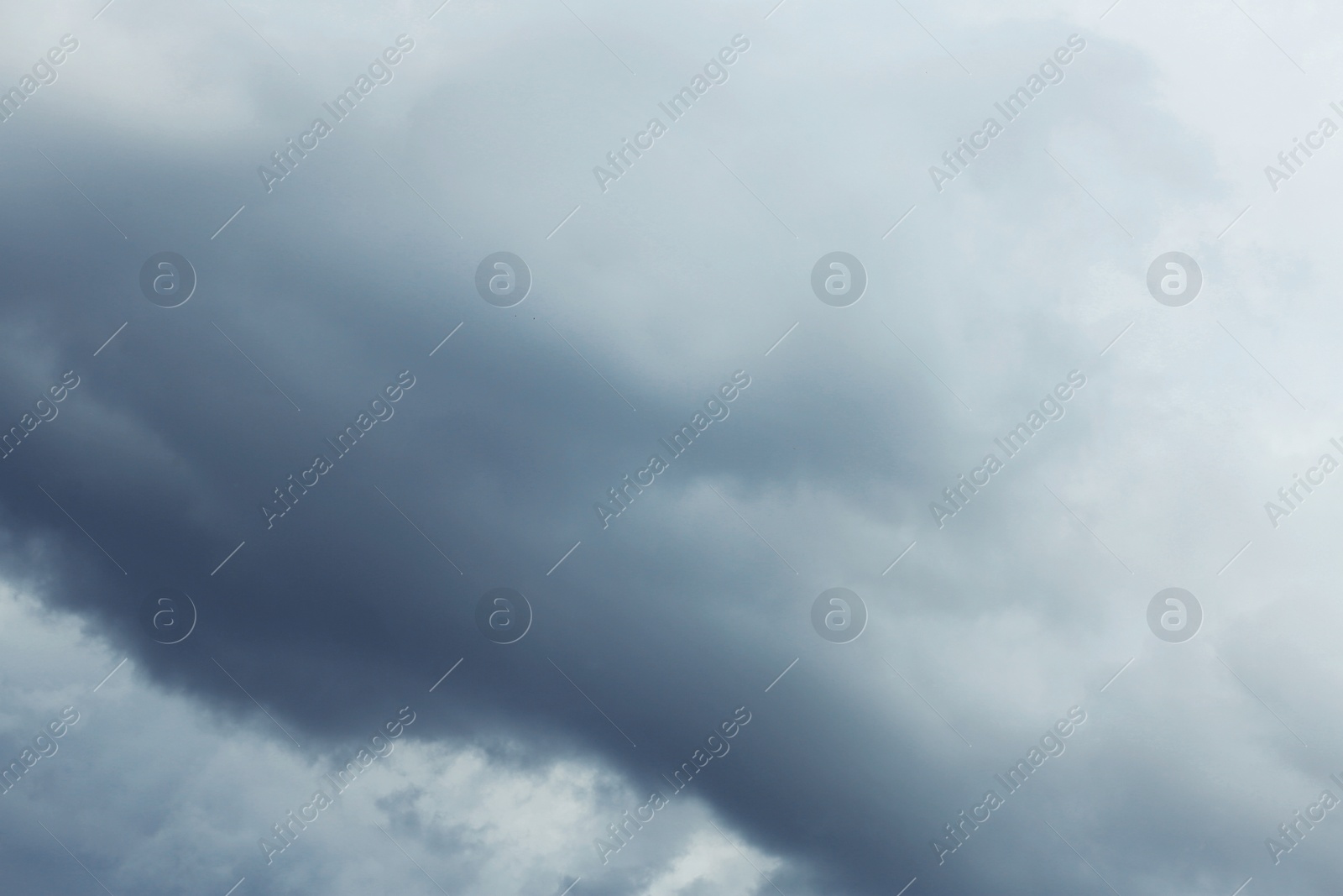 Photo of Sky with heavy rainy clouds on grey day