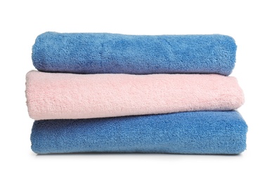 Photo of Folded soft terry towels on white background