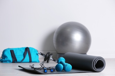 Photo of Set of fitness equipment on floor indoors
