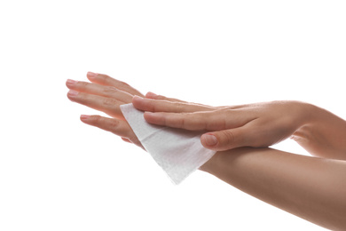 Photo of Woman cleaning hand with wet wipe on white background, closeup