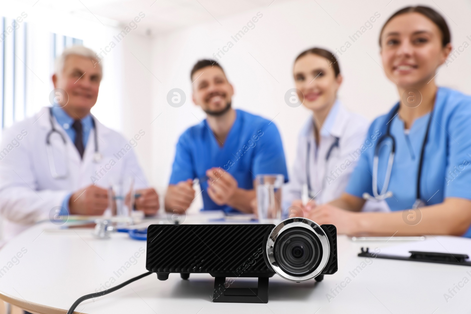 Photo of Video projector on table during medical conference