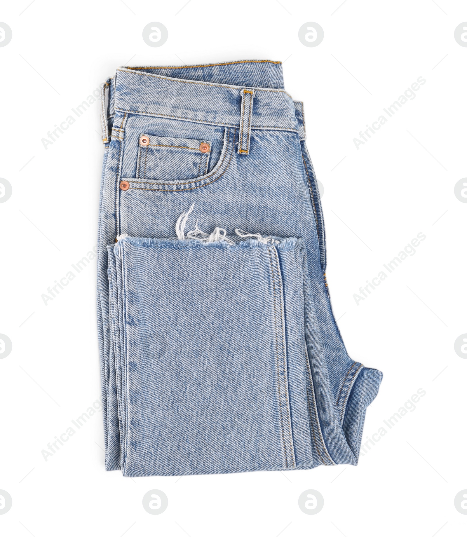 Photo of Light blue jeans isolated on white, top view. Stylish clothes