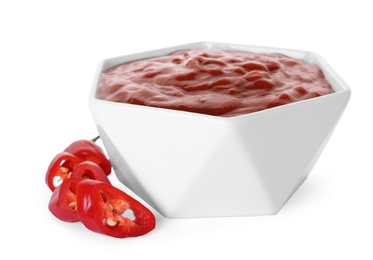 Photo of Bowl with red sauce and fresh chili peppers isolated on white