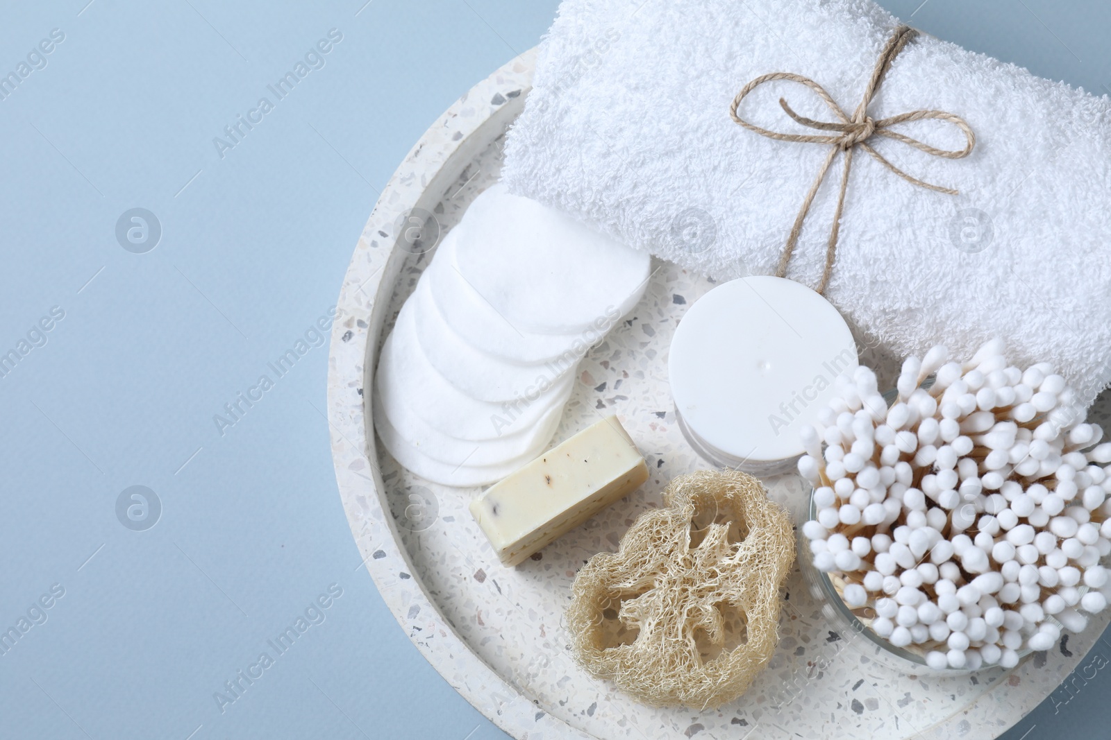 Photo of Bath accessories. Personal care products on light blue background, top view with space for text