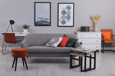 Photo of Stylish grey living room interior with comfortable sofa
