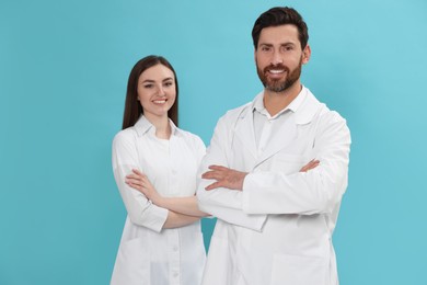Photo of Nurses in medical uniform on light blue background