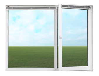 Image of Blue sky with clouds over green meadow, view through plastic window