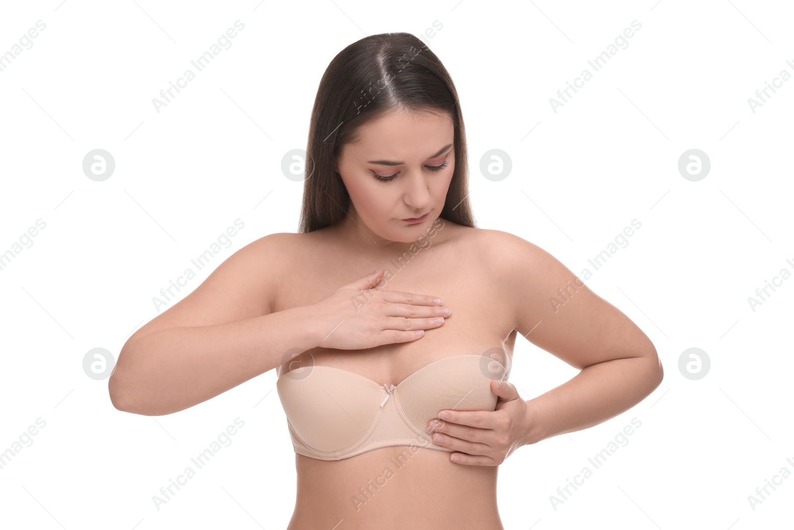 Photo of Mammology. Woman in bra doing breast self-examination on white background