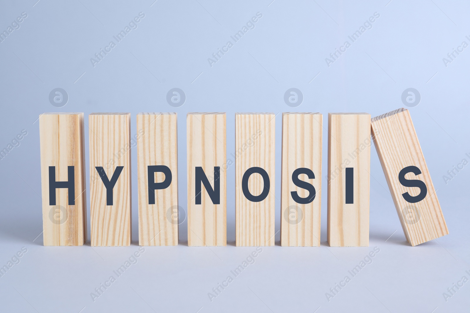 Photo of Wooden blocks with word HYPNOSIS on white background