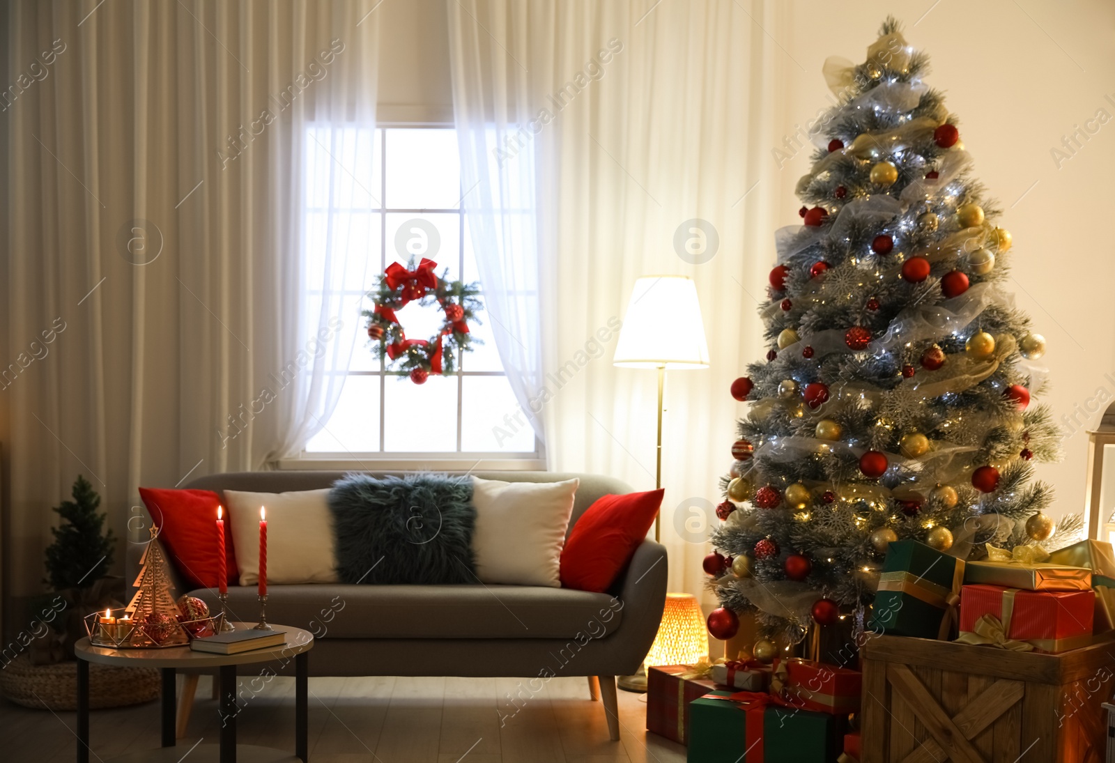 Image of Beautiful Christmas tree in living room. Festive interior