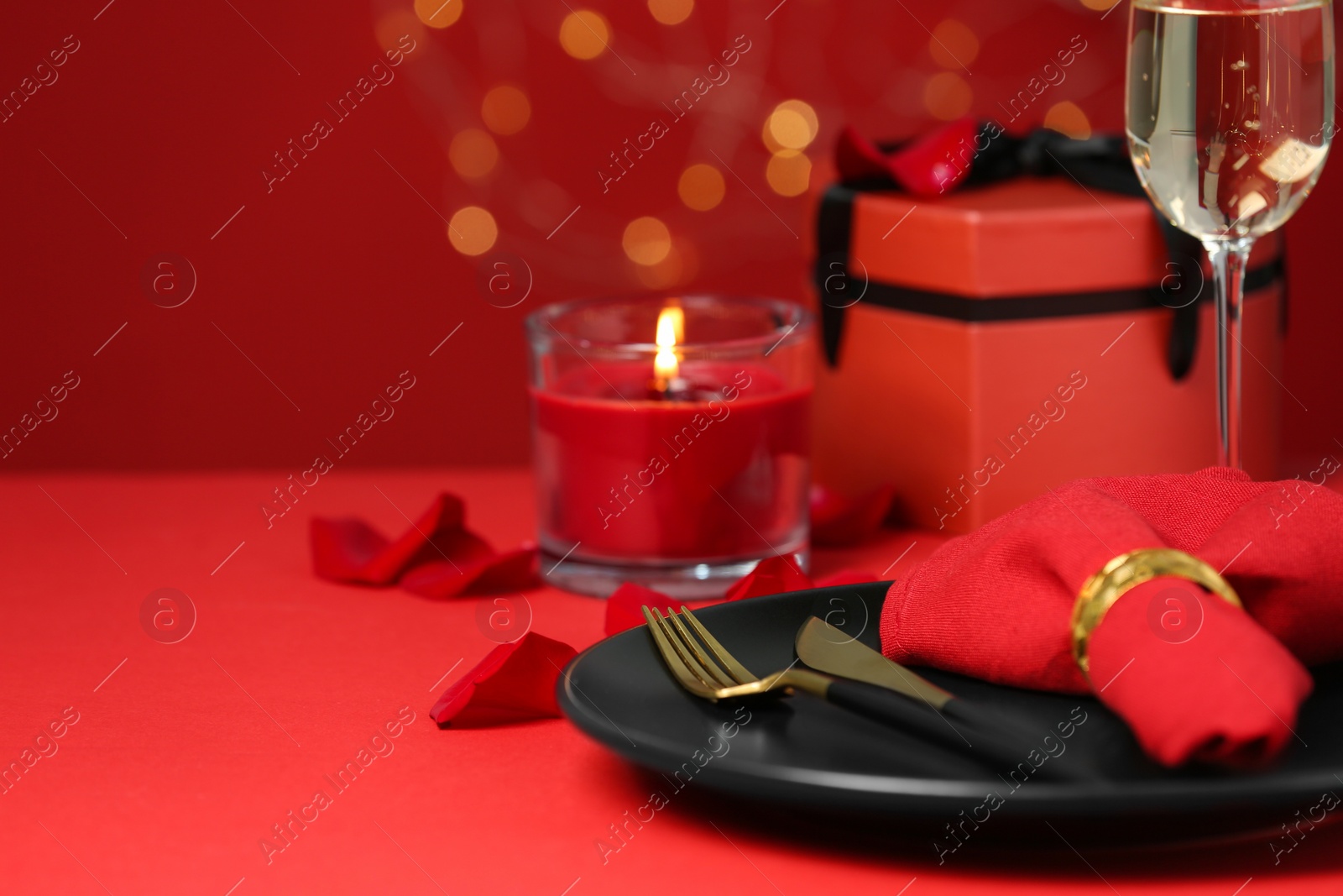 Photo of Beautiful table setting with burning candle for romantic dinner, closeup. Space for text