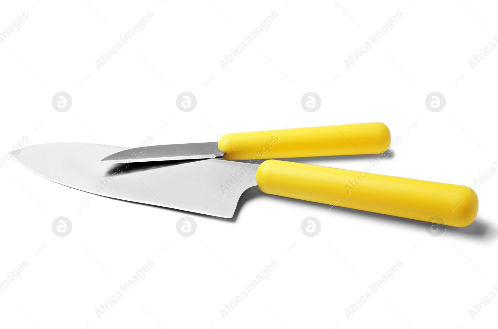 Photo of Modern sharp chef's and paring knives isolated on white