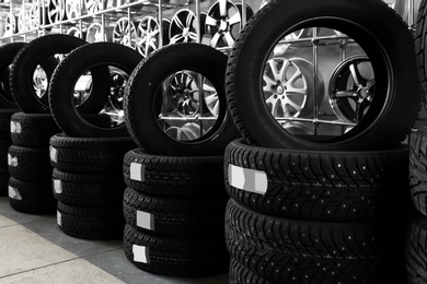 Car tires and alloy wheels in automobile service center