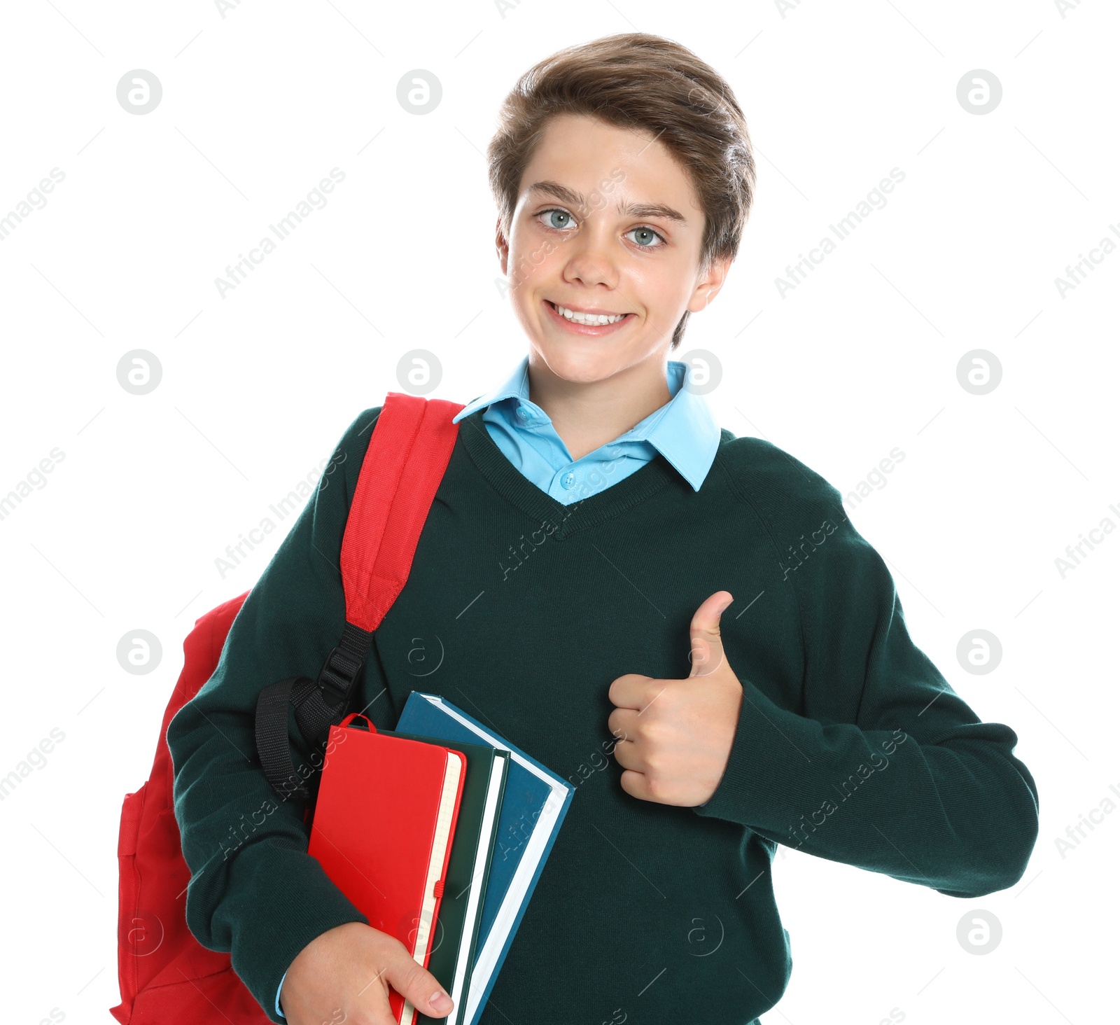 Photo of Happy boy in school uniform on white background