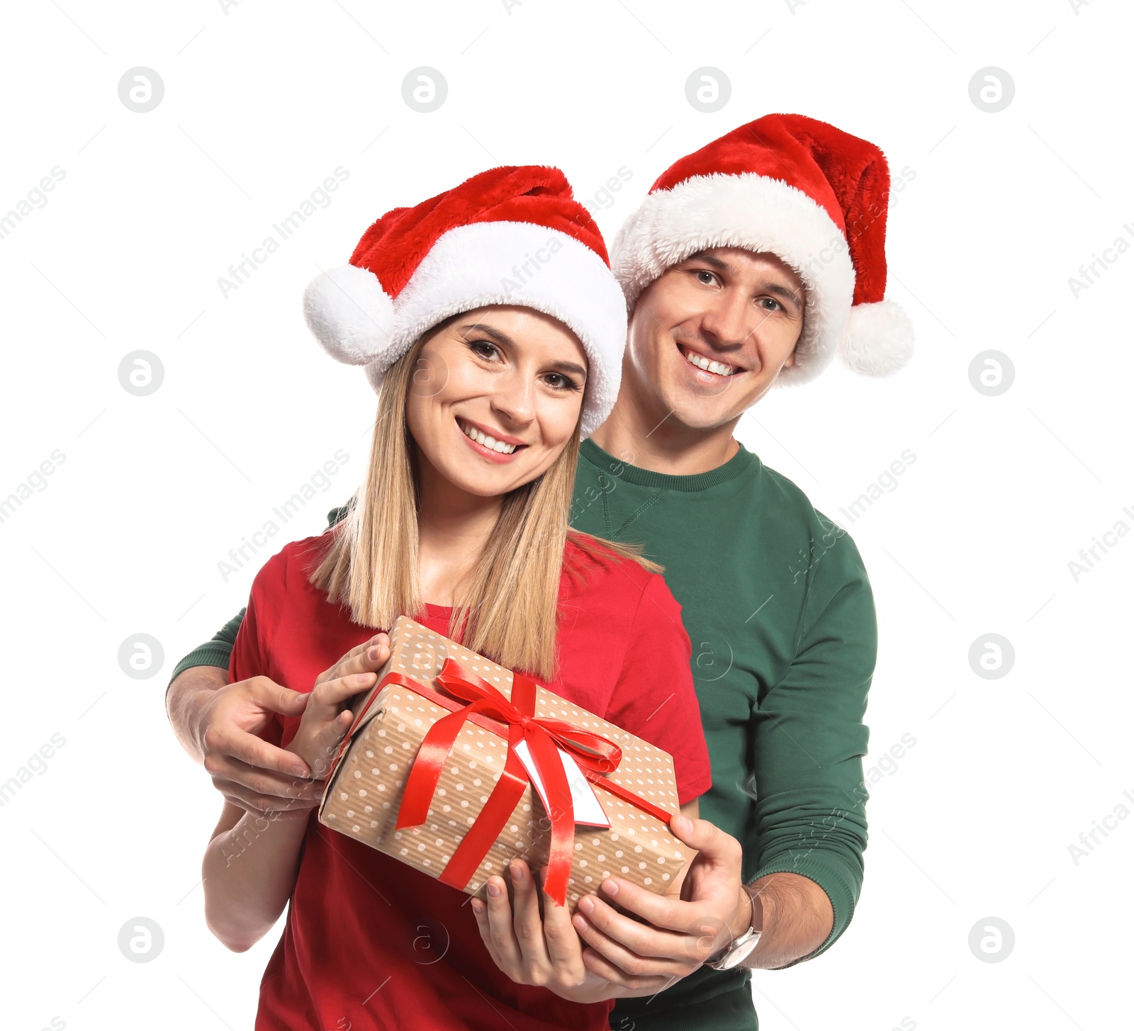 Photo of Young couple with Christmas gift on white background