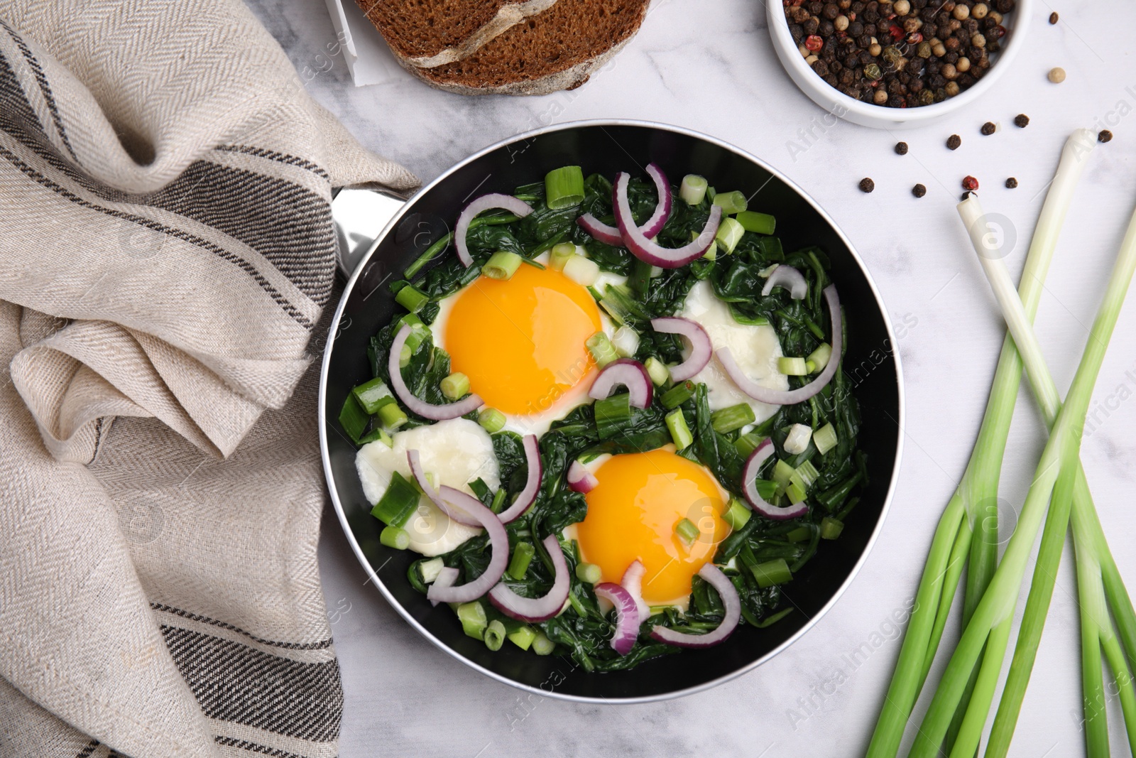 Photo of Flat lay composition with tasty Shakshouka and ingredients on white marble table