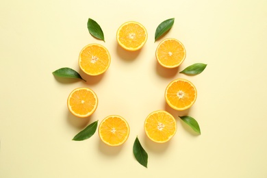 Photo of Flat lay composition with ripe oranges and space for text on color background