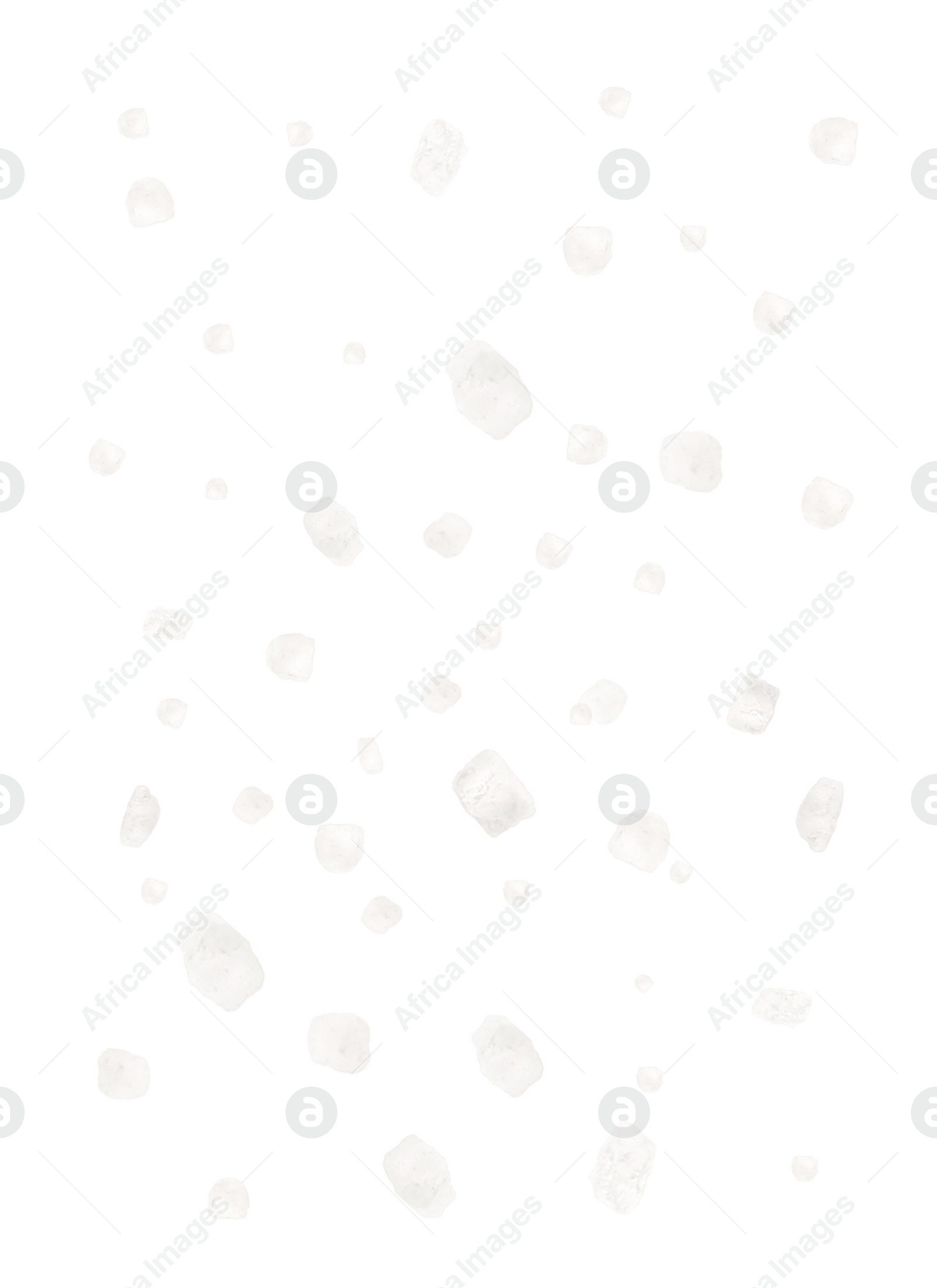 Image of Many salt crystals falling on white background