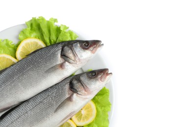 Photo of Plate with fresh sea bass fish, lettuce and lemon on white background, top view