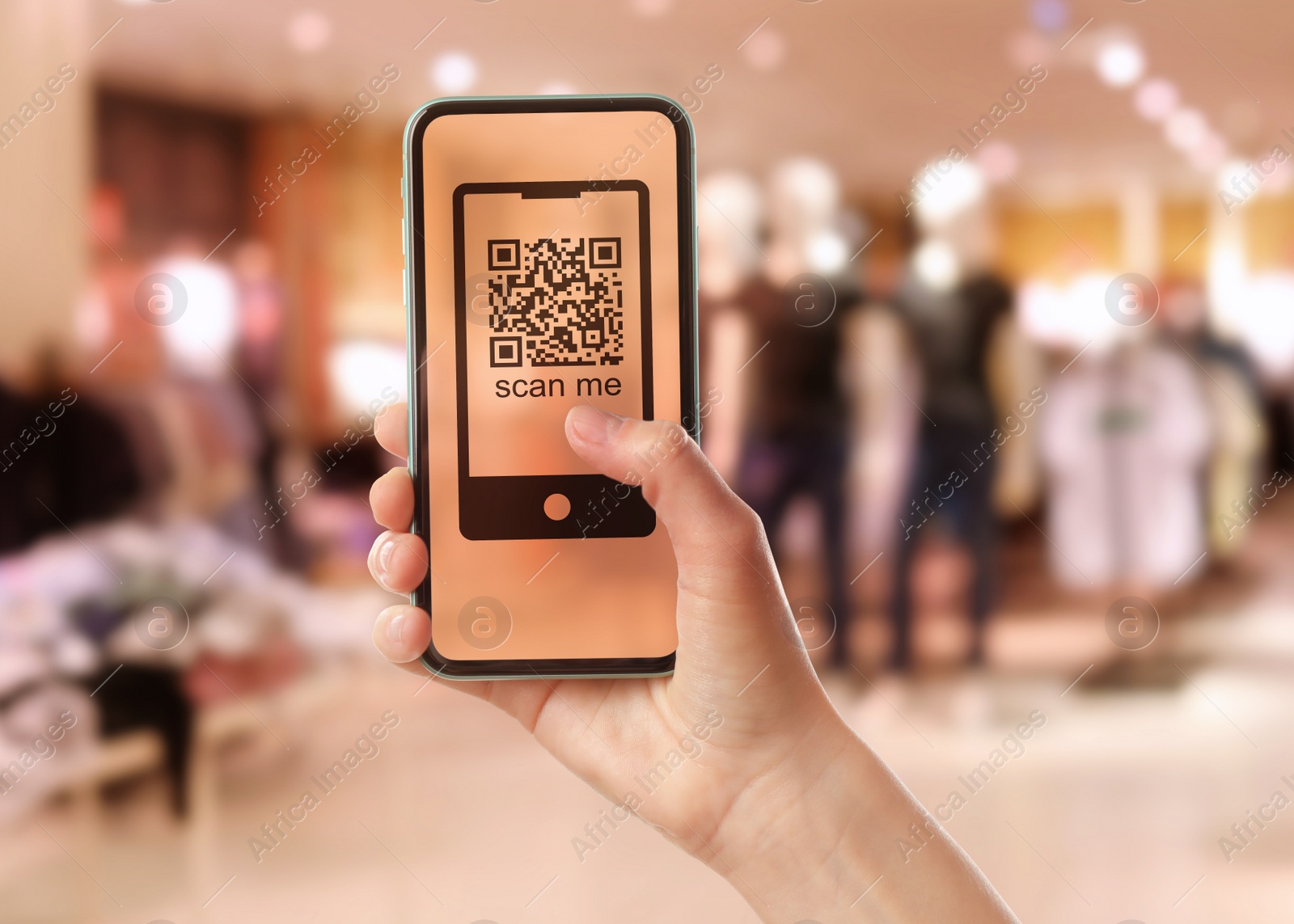 Image of Woman holding smartphone with QR code on screen in store, closeup