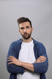 Photo of Portrait of handsome man on grey background