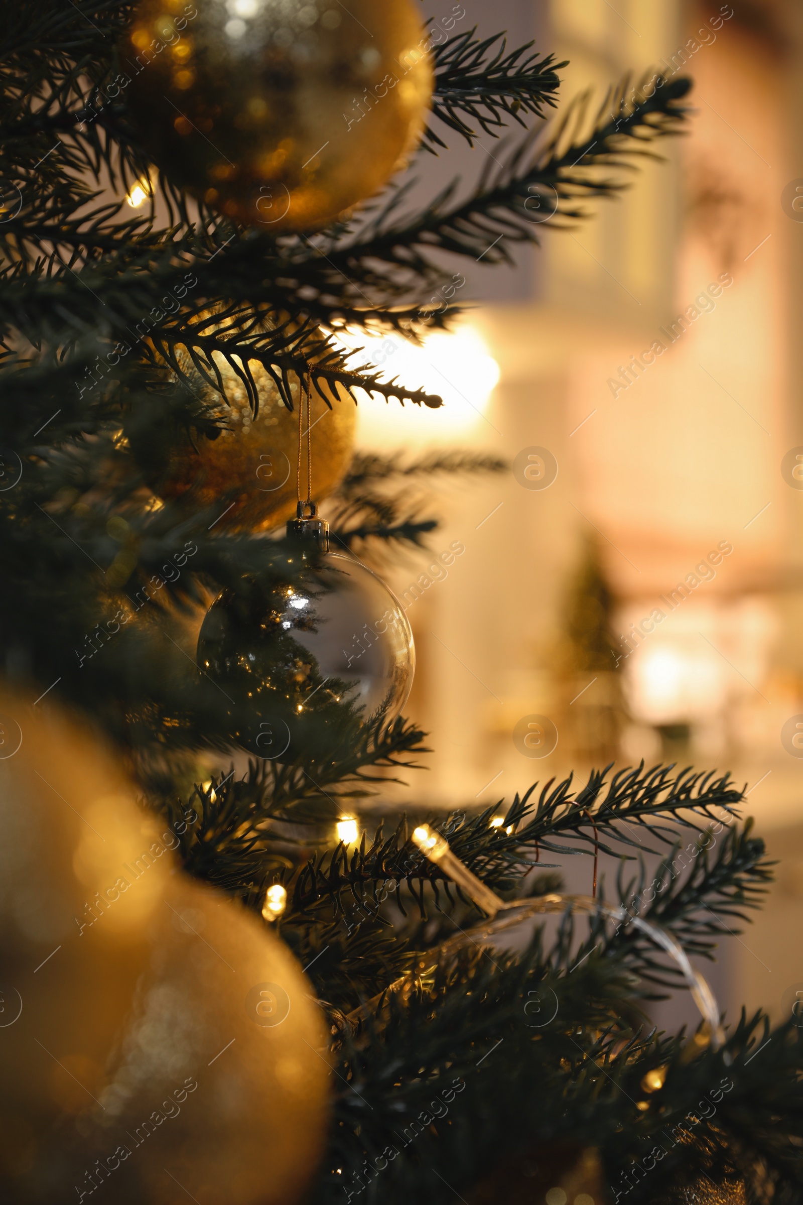 Photo of Closeup view of beautifully decorated Christmas tree indoors