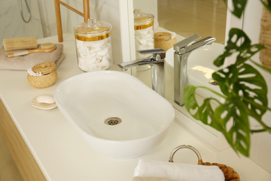 Photo of Clean vessel sink near mirror in stylish bathroom