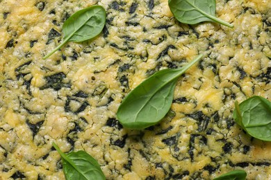 Delicious homemade spinach pie as background, top view