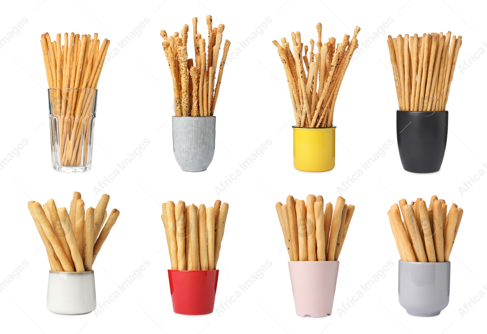 Image of Set with delicious crispy grissini sticks on white background