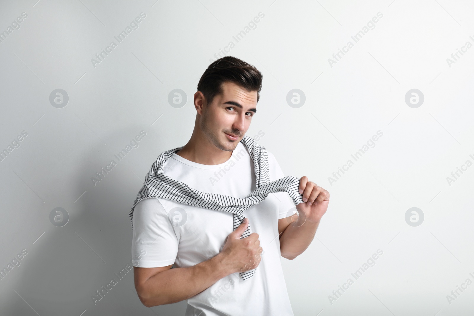 Photo of Portrait of handsome young man on white background