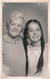 Image of Old picture of cute girl with her grandmother. Portrait for family tree