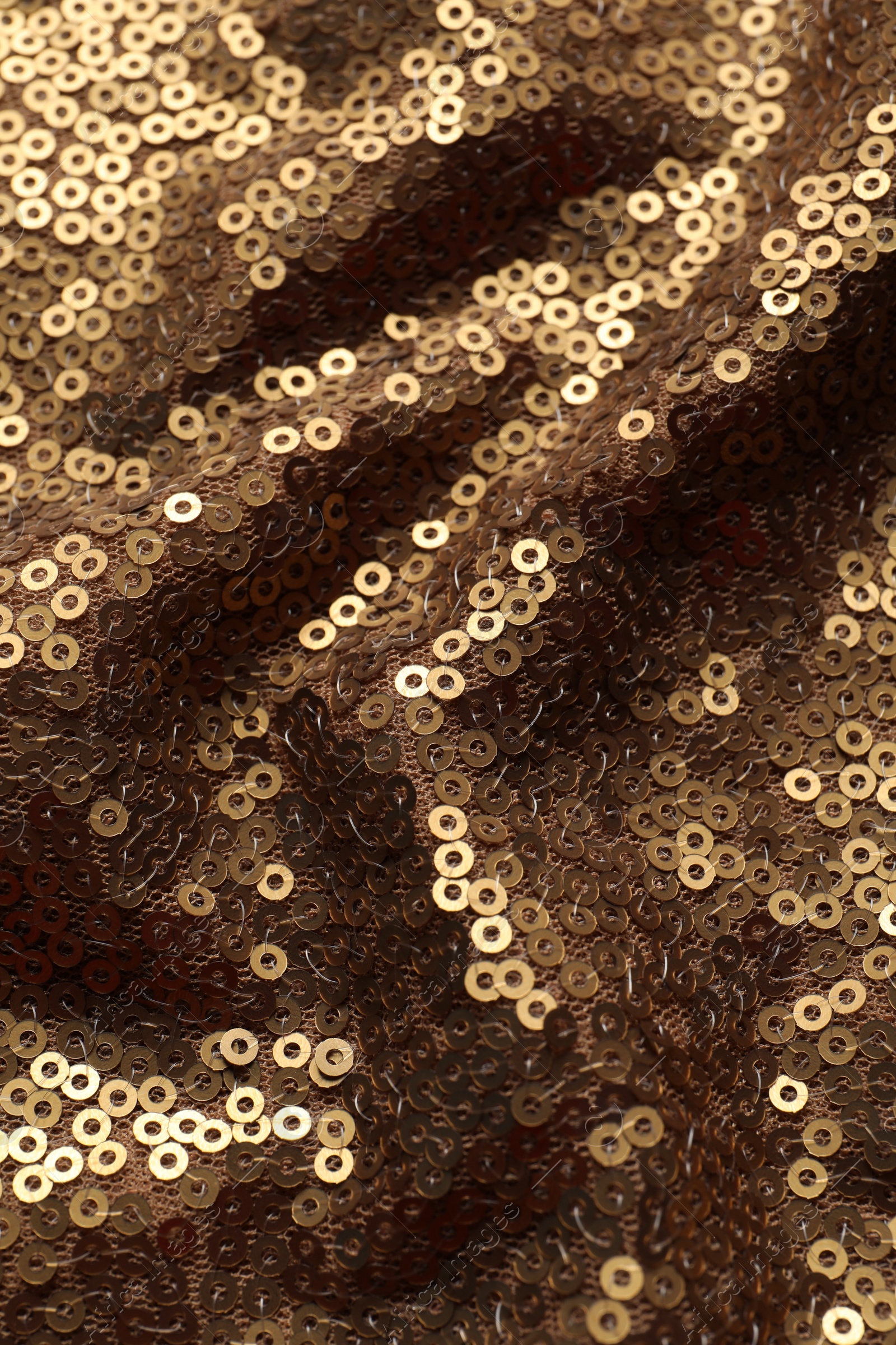 Photo of Beautiful golden sequin fabric as background, closeup