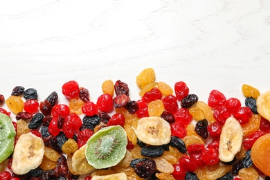 Photo of Different dried fruits on wooden background, top view with space for text. Healthy lifestyle