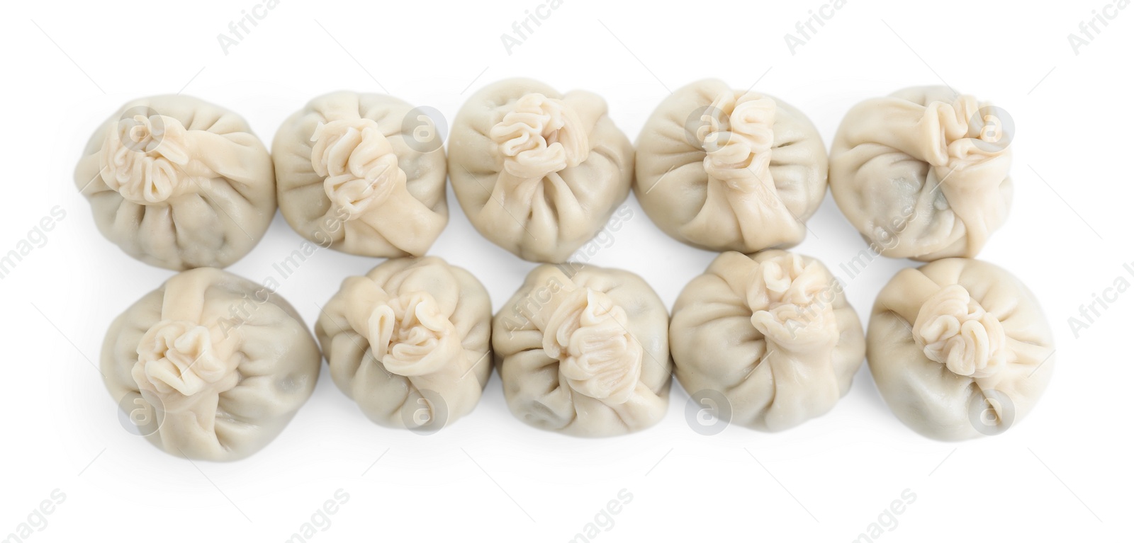 Photo of Many tasty khinkali (dumplings) isolated on white, top view. Georgian cuisine