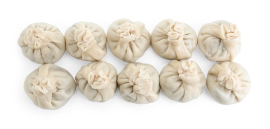 Photo of Many tasty khinkali (dumplings) isolated on white, top view. Georgian cuisine