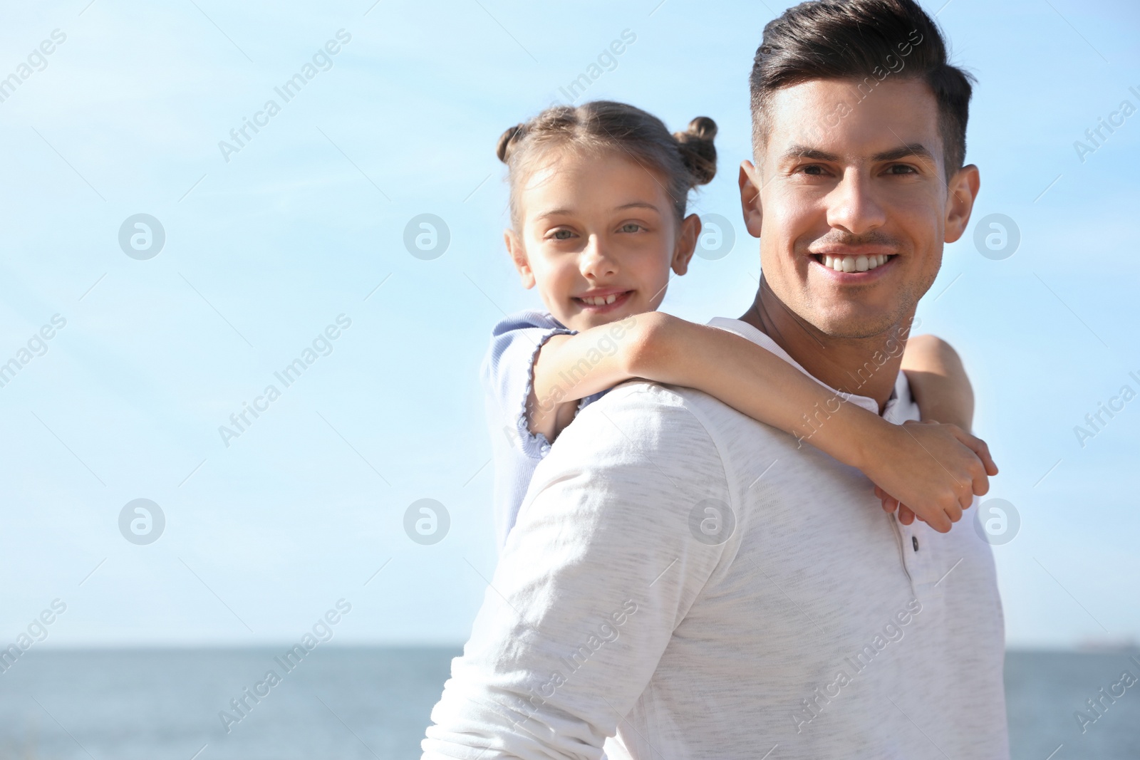 Photo of Father and daughter at beach. Family vacation