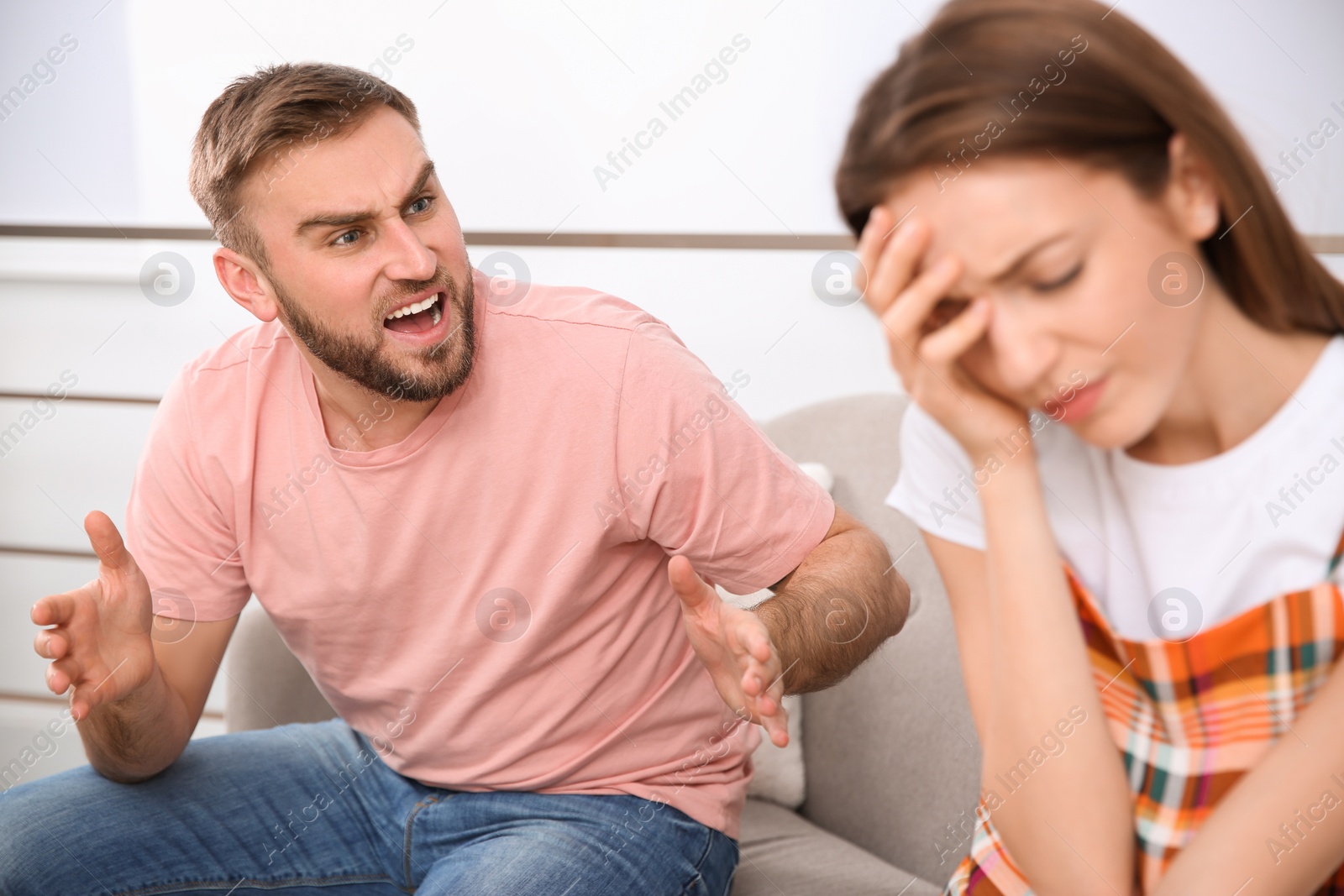 Photo of Couple having quarrel at home. Relationship problems