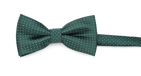 Stylish green bow tie with polka dot pattern on white background, top view