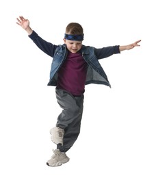 Photo of Happy little boy dancing on white background